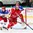 MINSK, BELARUS - MAY 20: Russia's Yegor Yakovlev #44 keeps close watch on Alexei Ugarov #18 of Belarus while Sergei Bobrovski #72 attempts to follow the play during preliminary round action at the 2014 IIHF Ice Hockey World Championship. (Photo by Andre Ringuette/HHOF-IIHF Images)

